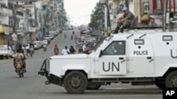 FILE - United Nations peacekeepers patrol along a street in Monrovia, Liberia, Nov. 8, 2011. Missions in Haiti, Liberia, Ivory Coast and Mali accounted for nearly 40 percent of peacekeeper-related abuse allegations in 2015.