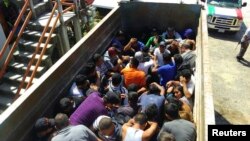 Des migrants dans un camion dans l'Etat de Oaxaca, au Mexique, le 19 février 2015.