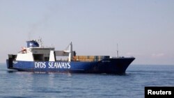 FILE - The Ark Futura, a Danish-chartered cargo vessel which is assisting in the effort to extract Syrian chemical weapons from the country, sails in the Eastern Mediterranean Sea.