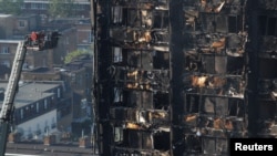 Damage is seen to a tower block which was destroyed in a fire disaster, in north Kensington, West London, Britain June 15, 2017. 