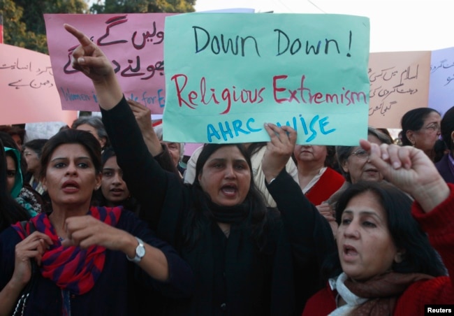 FILE - Women chant slogans condemning Islamist terrorism during an anti-terror rally in Lahore, Pakistan, Jan. 16, 2015. Experts say 13 of the approximately 60 U.S.-designated global terrorist organizations are based in Pakistan.