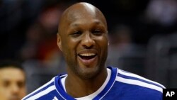 FILE - Los Angeles Clippers' Lamar Odom smiles during an NBA basketball practice in Los Angeles, March 13, 2013.