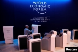 A staff checks elements of the stage ahead of the World Economic Forum (WEF) annual meeting in the Swiss Alps resort of Davos, Switzerland, Jan. 21, 2018