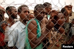 FILE - Ethiopia migrant workers seeking jobs in Saudi Arabia are turned back on March 16, 2012, in Haradh, a town in western Yemen.