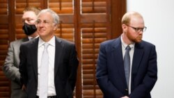 Travis McMichael, right, stands next to his attorney as he attends the jury selection in his trial together with Gregory McMichael and their neighbour, William "Roddie" Bryan, at Gwynn County Superior Court, in Brunswick, Georgia, Oct. 27, 2021.