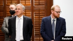 Travis McMichael, right, stands next to his attorney as he attends the jury selection in his trial together with Travis McMichael and their neighbour, William "Roddie" Bryan, at Gwynn County Superior Court, in Brunswick, Georgia, Oct. 27, 2021.