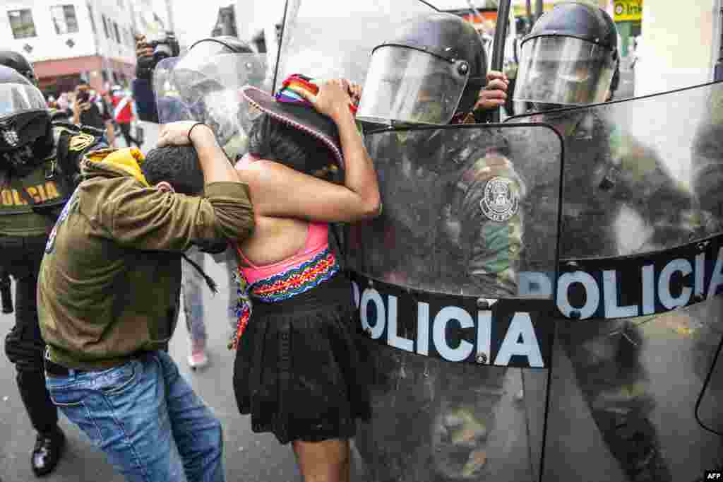 Supporters of ousted Peruvian President Martin Vizcarra, who was removed in an impeachment vote late Monday, protest against the new government in Lima.