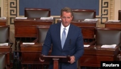 FILE - U.S. Senator Jeff Flake (R-AZ) announces he will not seek re-election as he speaks on the Senate floor in this still image taken from video on Capitol Hill in Washington, Oct. 24, 2017.