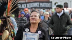 Lynn Eagle Feather protests in a demonstration against the police shooting of her son, Paul Castaway, in July 2015.