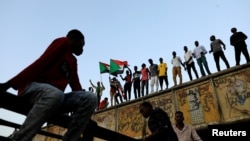 FILE - Sudanese protesters rally in front of army headquarters in Khartoum, Sudan, May 6, 2019.