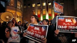 FILE - Demonstrators protest Republican presidential candidate Donald Trump's guest host appearance on "Saturday Night Live" at NBC Studios in New York, Nov. 4, 2015. 