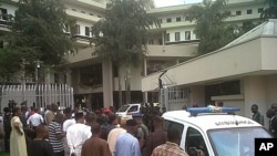 This image released by Saharareporters shows ambulances and rescue workers after a large explosion struck the United Nations' main office in Nigeria's capital Abuja, August 26, 2011