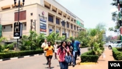 People run from the Westgate Mall in Nairobi, Kenya, after gunmen threw grenades and opened fire during an attack.