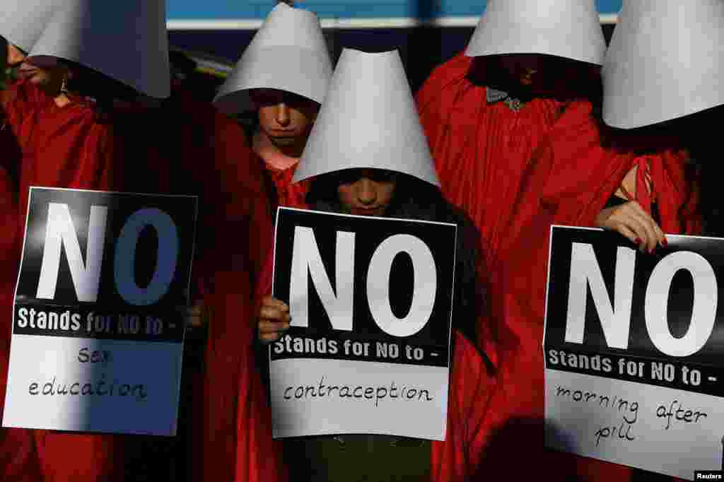 Pro-Choice activists dress up as characters from the Handmaid's Tale in a City centre demonstration ahead of a May 25 referendum on abortion law, in Dublin, Ireland.