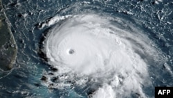 This satellite image obtained from NOAA/RAMMB, shows Tropical Storm Dorian as it approaches the Bahamas and Florida at 12:00 UTC on September 1, 2019.