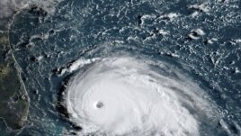This satellite image from NOAA/RAMMB, shows Tropical Storm Dorian as it approached the Bahamas and Florida, September 1, 2019.