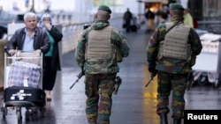 Belgian soldiers patrol at Zaventem international airport near Brussels, Nov. 21, 2015, after security was tightened in Belgium following the fatal attacks in Paris. 