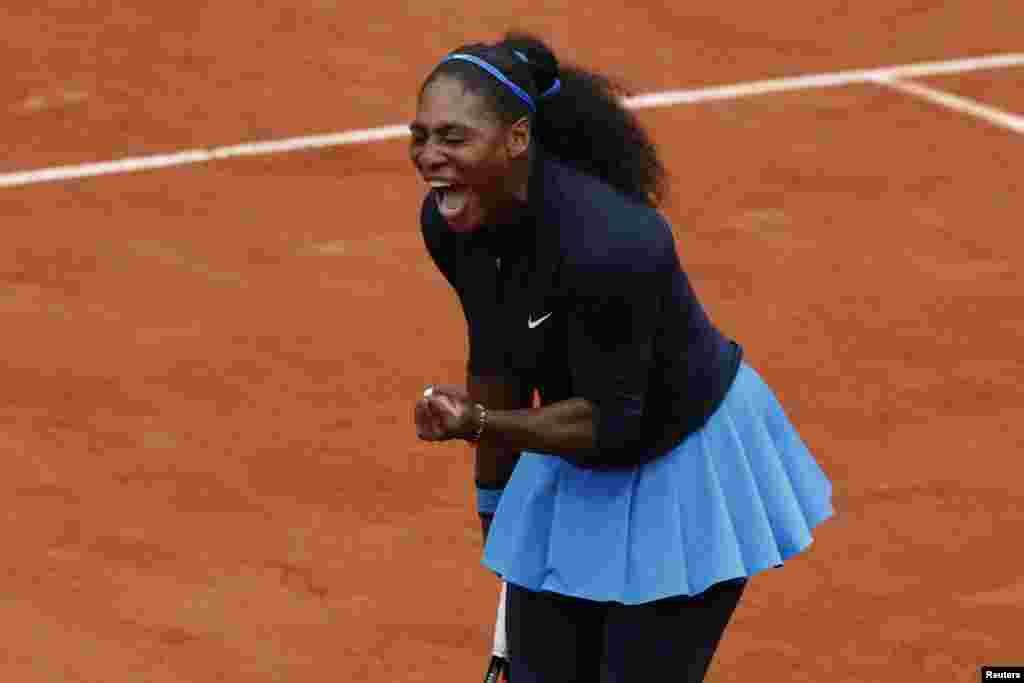 Serena Williams clenches her fist after scoring a point in the French Open Women Singles Semifinal match against Netherlands' Kiki Bertens at the Roland Garros stadium in Paris, France.