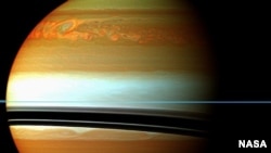 These red, orange and green clouds (false color) in Saturn's northern hemisphere indicate the tail end of a massive storm that started in December 2010. 