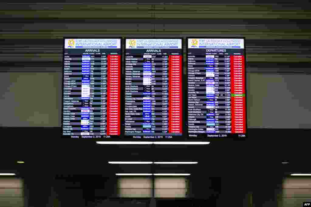 An information board displaying canceled flights is seen in the departure hall at Fort Lauderdale-Hollywood International Airport in Fort Lauderdale, Florida. The airport closed at noon due to a mandatory closure order due to winds of Hurricane Dorian.