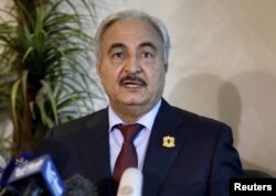 FILE - Libyan General Khalifa Haftar, chief of the army loyal to the internationally recognized government, speaks during a news conference in Amman, Jordan, Aug. 24, 2015.