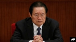 FILE - Zhou Yongkang, then Chinese Communist Party Politburo Standing Committee member in charge of security, attends a plenary session of the National People's Congress at the Great Hall of the People in Beijing, China. 