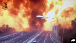 In this frame grab taken from a video released by the Italian police, the moment a truck that was transporting flammable substances explodes after colliding with another truck on a highway on the outskirts of Bologna, Aug. 6, 2018. 