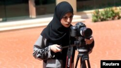 A Saudi woman studies film making at a university in Jeddah, Saudi Arabia, March 7, 2018.