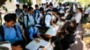 Students register to participate in a campaign by the National Election Committee, NEC, in Phnom Penh, Cambodia, May 9, 2018.