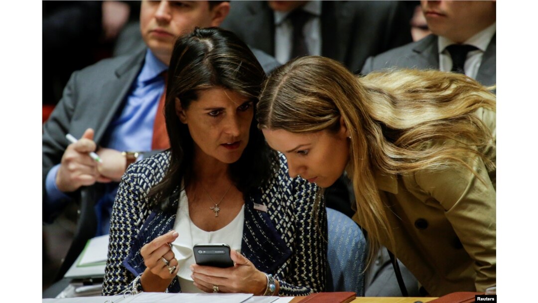 FILE - United States Ambassador to the United Nations Nikki Haley talks with one of her delegation members during the United Nations Security Council meeting on Syria at the U.N. headquarters in New York, April 13, 2018.