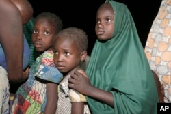 FILE - Children rescued by Nigeria soldiers from captivity from Islamist extremists at Sambisa forest arrive at a camp in Yola, Nigeria, May 2, 2015.