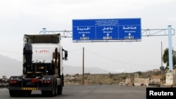 A truck drives on the main road linking Hodeidah with Sanaa, Yemen, Sept.13, 2018. 