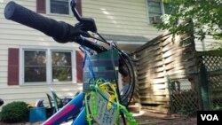 A bike awaits a 17-year-old refugee at the Ralbovsky home in Greenbelt, Maryland. The couple plan to take their foster son to the nearby farmers’ market and summer music festivals if the U.S State Department approves his travel to the U.S. (A. Arabasadi/V