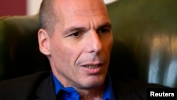 Greek Finance Minister Yanis Varoufakis speaks during his meeting with Britain's Chancellor of the Exchequer, George Osborne, at Downing Street in London, Feb. 2, 2015. 
