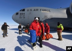 Secretary of State John Kerry, center, disembarks from a U.S. Air Force C17 Globemaster in Antarctica, Nov. 11, 2016. Kerry holds the record for the most countries visited while secretary of state.