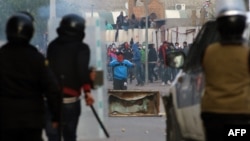 Protesters clash with security forces in the central town of Kasserine, Tunisia, Jan. 21, 2016.