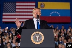 President Donald Trump speaks to a Venezuelan American community at Florida Ocean Bank Convocation Center at Florida International University in Miami, Florida, Feb. 18, 2019.