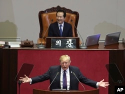 U.S. President Donald Trump delivers a speech as South Korea's National Assembly Speaker Chung Sye-kyun, top, listens at the National Assembly in Seoul, South Korea, Wednesday, Nov. 8, 2017.