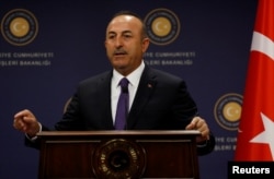 Turkish Foreign Minister Mevlut Cavusoglu gestures during a news conference in Ankara, Turkey, April 16, 2018.