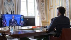 French President Macron listens to U.S. President Joe Biden during a Climate Summit video conference, at the Elysee Palace in Paris, France, 22 April 2021. (Ian Langsdon/Pool via REUTERS)