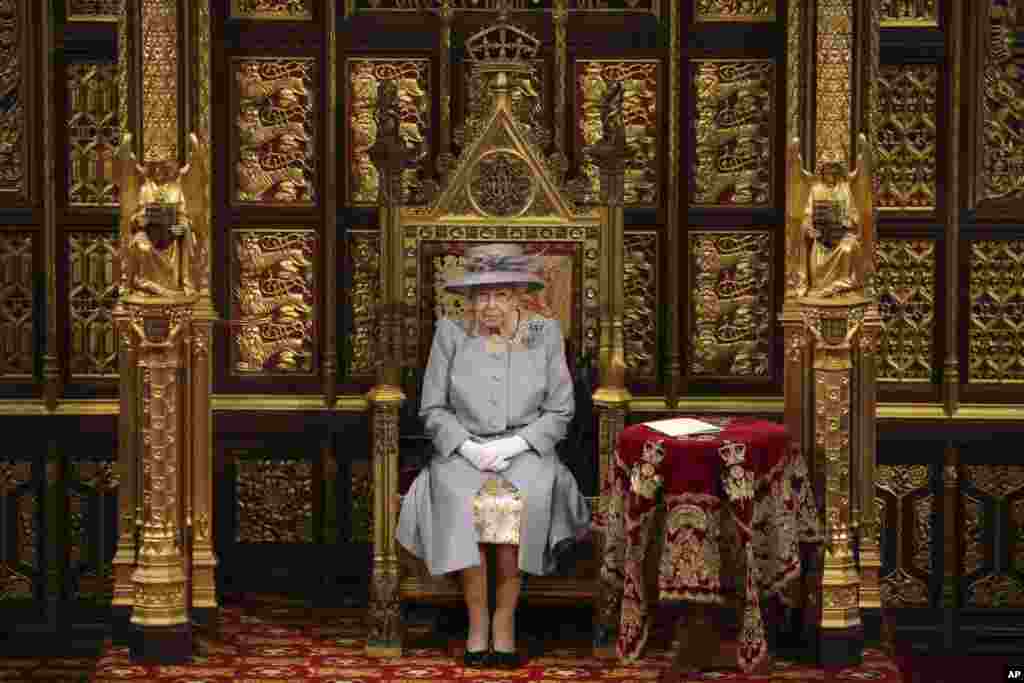 Britain&#39;s Queen Elizabeth II delivers a speech in the House of Lords during the State Opening of Parliament at the Palace of Westminster in London.