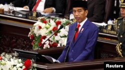 Presiden Joko Widodo membacakan pidato di Sidang Tahunan MPR di Gedung Parlemen, Senayan, 16 Agustus 2018.