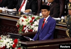 FILE - Indonesian President Joko Widodo deliver a speech in front of parliament members at the parliament building in Jakarta, Indonesia, Aug. 16, 2018.