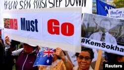 Protesters hold placards and banners during a demonstration against Cambodia's Prime Minister Hun Sen, who is attending the one-off summit of 10-member Association of Southeast Asian Nations (ASEAN), in Sydney, Australia, March 16, 2018. 