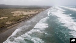 Muriwai beach is seen Nov. 27, 2016, after the chartered fishing boat Francie disappeared off Auckland, New Zealand. The Francie, carrying 11 people, disappeared in large waves Saturday at the entrance to Kaipara Harbour near Auckland. 