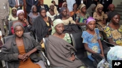 In this photo released by the Nigeria State House, Chibok schoolgirls recently freed from Boko Haram captivity are seen during a meeting with Nigeria's Vice President Yemi Osinbajo, in Abuja, Nigeria, Oct. 13, 2016.