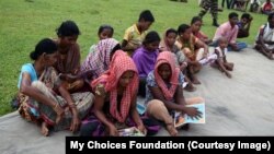 A Group of tribal tea garden workers in West Bengal, learning about the threat from traffickers. 