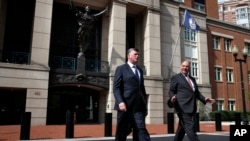 Kevin Downing, left, and Thomas Zehnle, with the defense team for Paul Manafort, leave federal court during the second day of jury deliberations in the trial of the former Trump campaign chairman, in Alexandria, Va., Aug. 17, 2018.