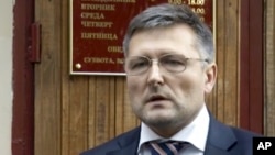FILE - In this frame grab made from Sept. 13, 2012 AP video, lawyer Nikolai Govorkov leaves a court in Moscow.