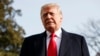 FILE - President Donald Trump pauses as he talks to media before boarding Marine One on the South Lawn of the White House in Washington, Dec. 8, 2018.